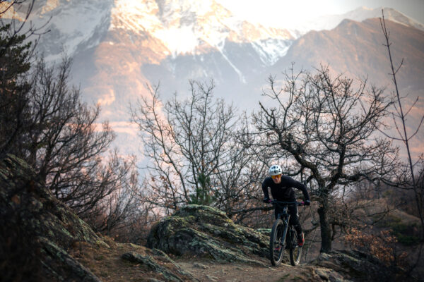 Cyclist is riding his bike on the trail