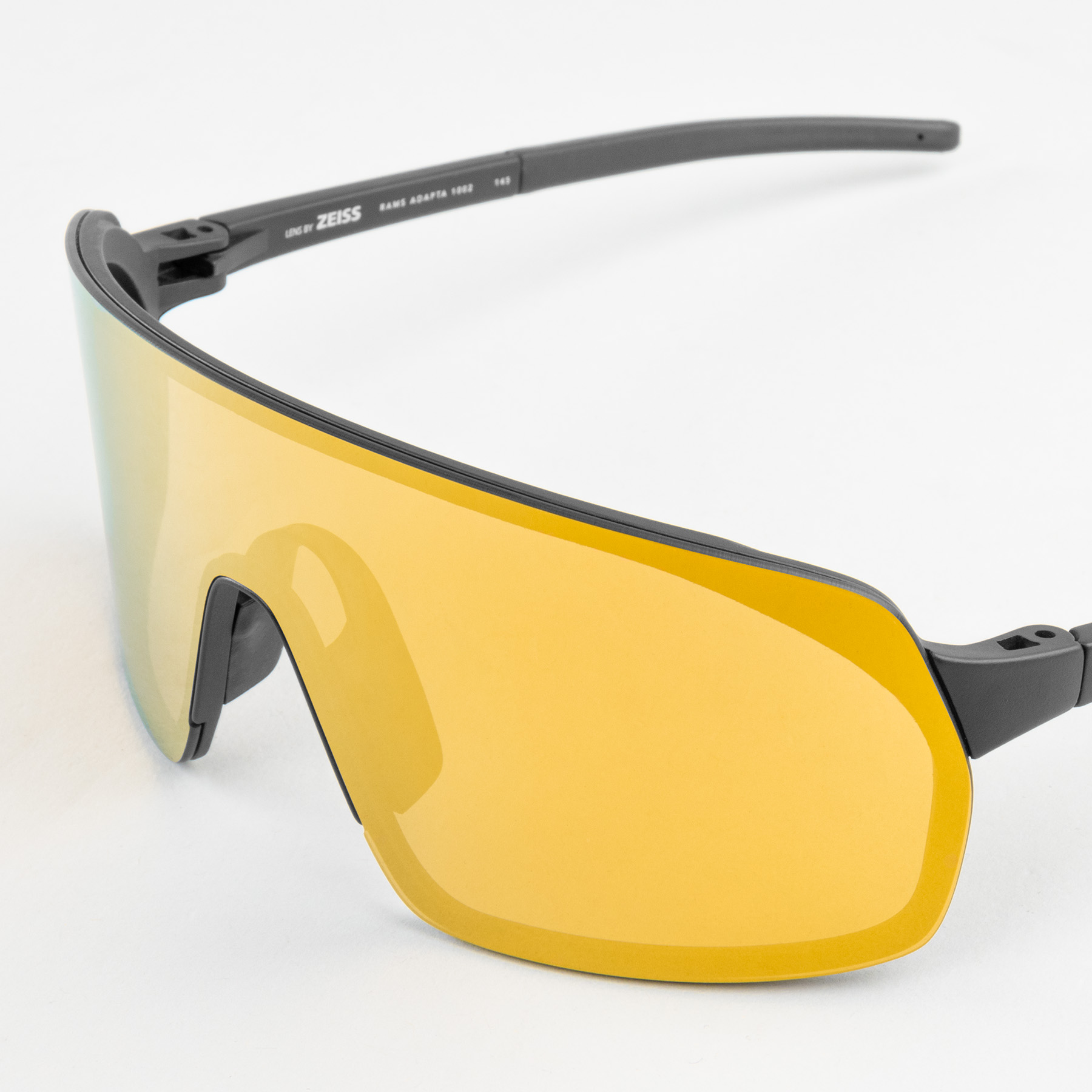 Sports sunglasses OUT OF Rams Gold on the white background, view slightly from the side and up